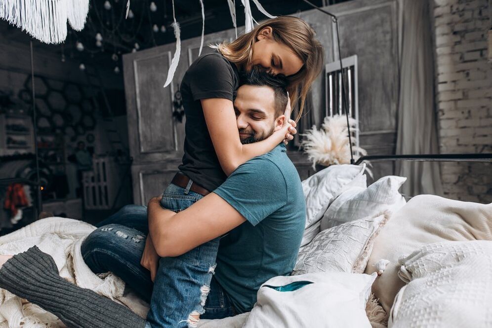Woman hugs man who increases potency